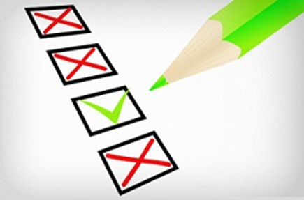 An illustration image of a green pencil and a series of checkmark boxes where some boxes are marked with red crosses 'x' and others with a green check. 